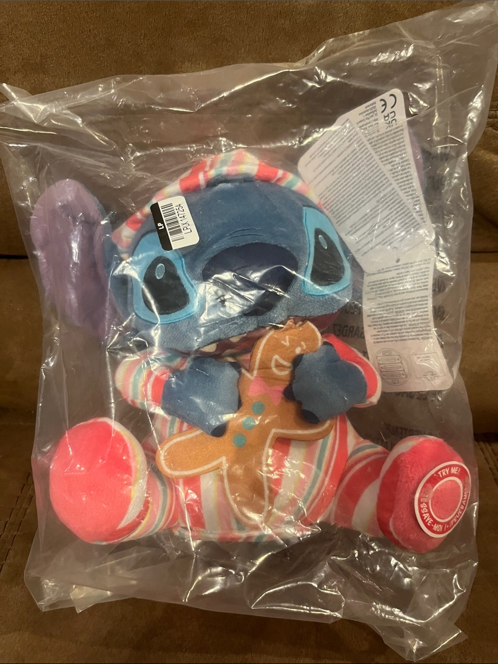 Disney Stitch Plush in Blue, Pink, Purple and Red Holiday Pajamas